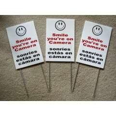 3 SMILE YOU'RE ON CAMERA SIGNS 8"x12" w/ Stakes Security Surveillance Spanish