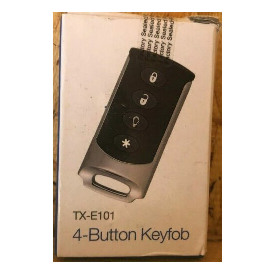 Brand New Interlogix TX-E101 Four Button Chrome Wireless Keyfob LED confirmation image {1}